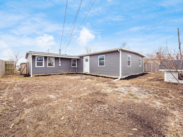 back of property with fence