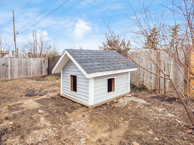 view of shed with fence