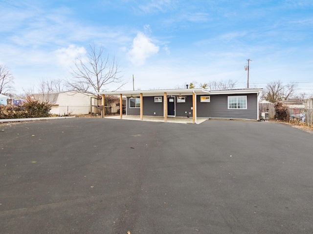 view of front of home featuring fence