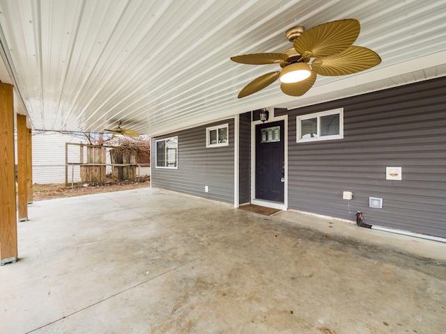 view of patio / terrace with fence and a ceiling fan