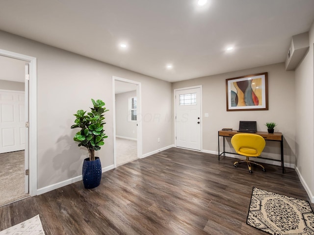 foyer entrance with baseboards, wood finished floors, and recessed lighting