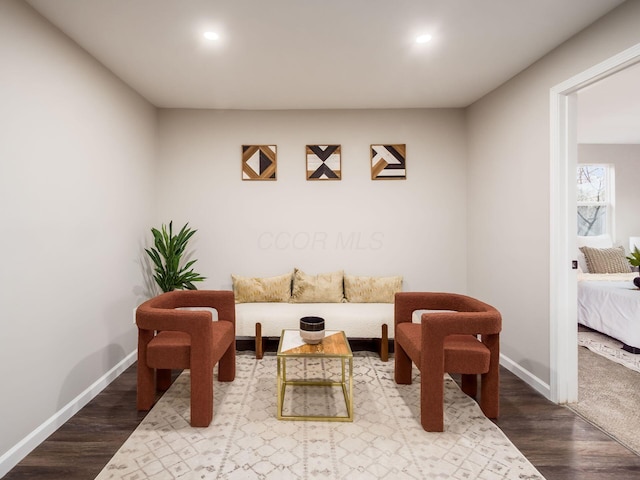 interior space with recessed lighting, baseboards, and wood finished floors