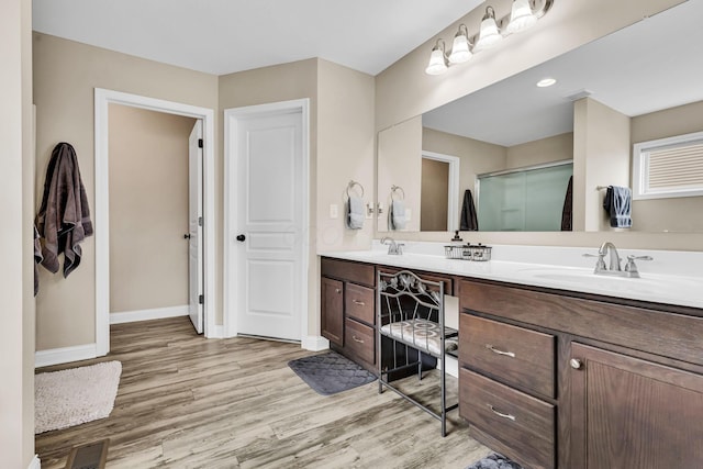 7179 Seymour Ct, Canal Winchester, OH 43110 - bathroom featuring double vanity, wood finished floors, and a shower