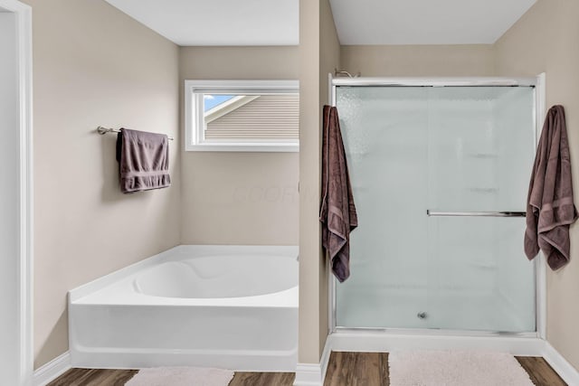 7179 Seymour Ct, Canal Winchester, OH 43110 - full bath with a shower stall, wood finished floors, and a garden tub
