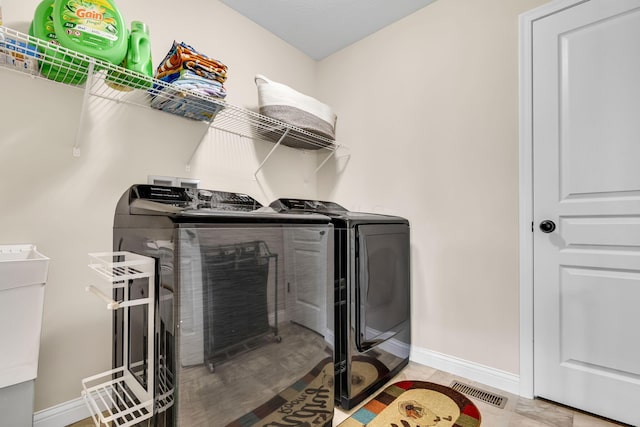 7179 Seymour Ct, Canal Winchester, OH 43110 - laundry room featuring separate washer and dryer and baseboards