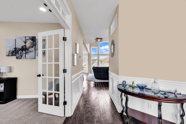 7179 Seymour Ct, Canal Winchester, OH 43110 - hallway with wainscoting, a decorative wall, and wood finished floors