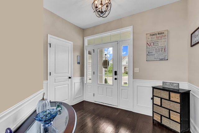 7179 Seymour Ct, Canal Winchester, OH 43110 - entrance foyer with a wainscoted wall, a chandelier, dark wood-style floors, and a decorative wall