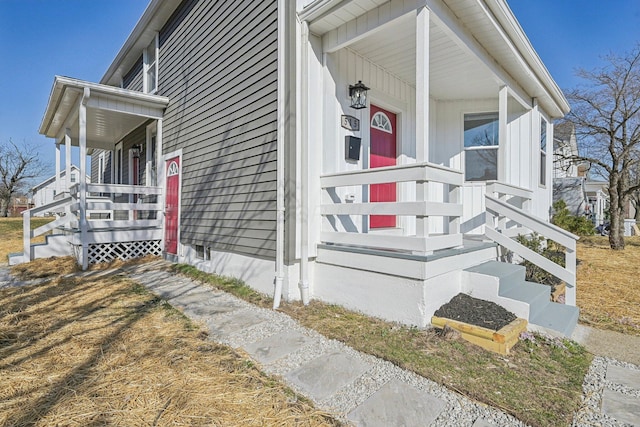 view of exterior entry with covered porch