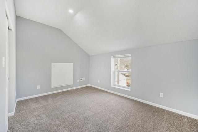 bonus room with vaulted ceiling, baseboards, carpet floors, and a textured ceiling