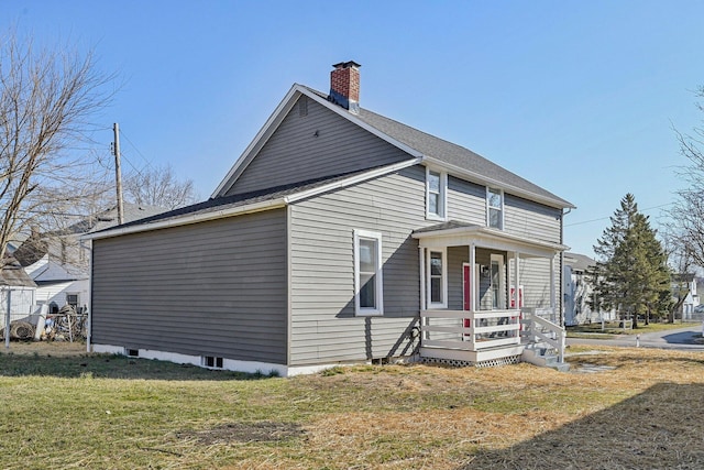 exterior space featuring a yard, covered porch, and a chimney