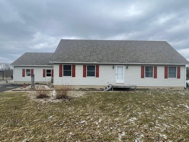 view of front of house featuring roof with shingles