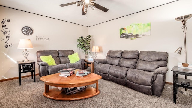 carpeted living area featuring baseboards and a ceiling fan