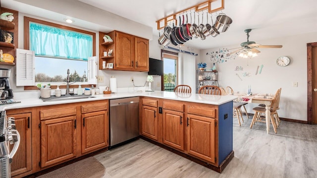 kitchen featuring open shelves, a peninsula, brown cabinets, and appliances with stainless steel finishes