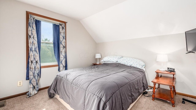 bedroom featuring vaulted ceiling, carpet flooring, and baseboards