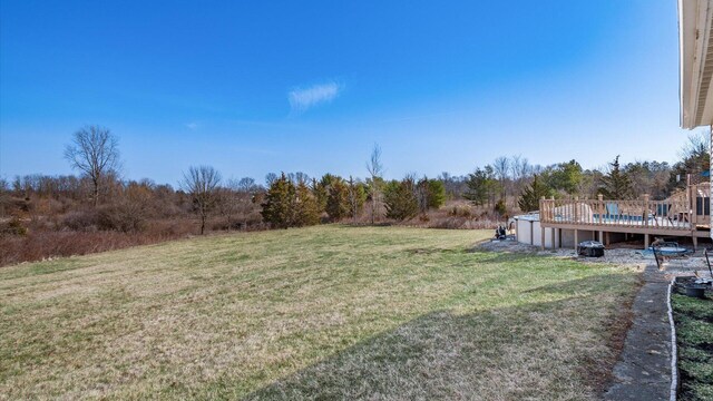 view of yard with a wooden deck