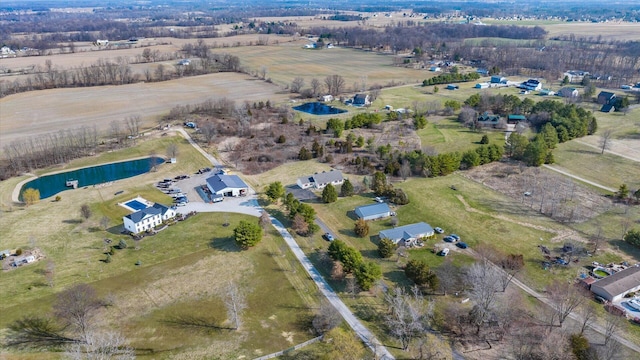 birds eye view of property featuring a rural view