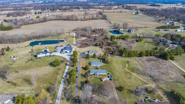 drone / aerial view with a water view and a rural view