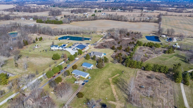 aerial view with a rural view and a water view