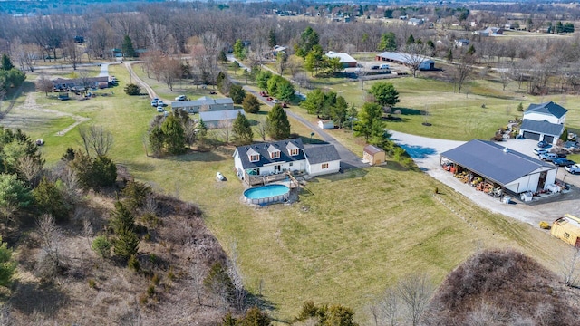 birds eye view of property with a rural view