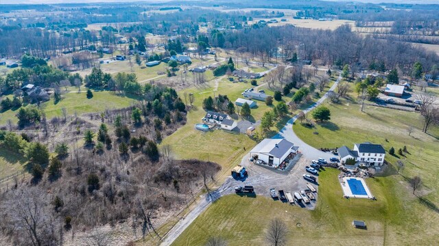 birds eye view of property with a rural view