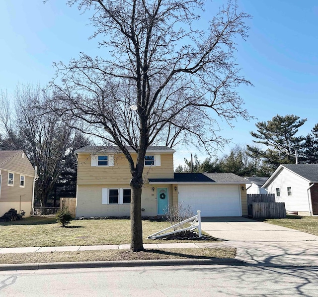 view of front of house with driveway, a front lawn, an attached garage, and fence