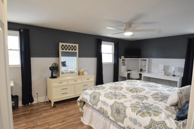 bedroom featuring a ceiling fan and wood finished floors