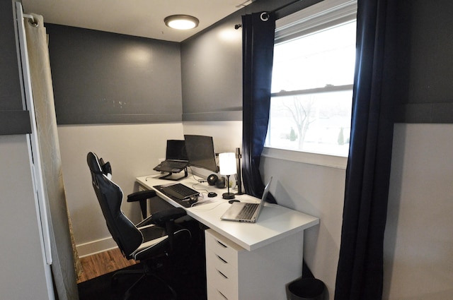 office space featuring wood finished floors and baseboards