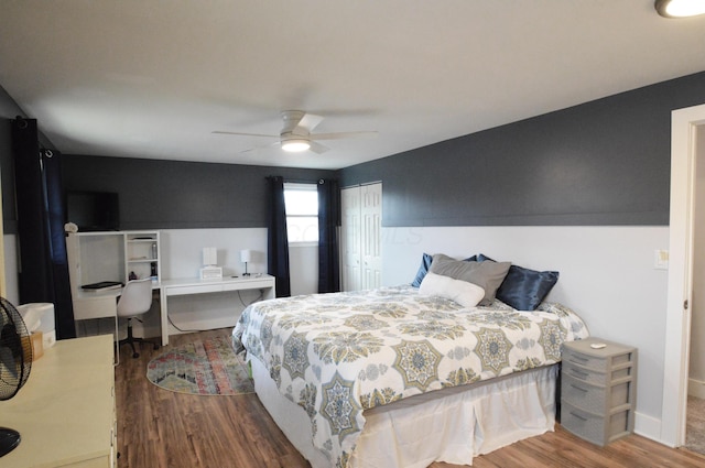 bedroom with a closet, ceiling fan, and wood finished floors