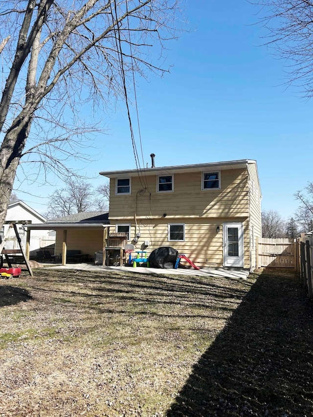 rear view of property with a patio area and fence