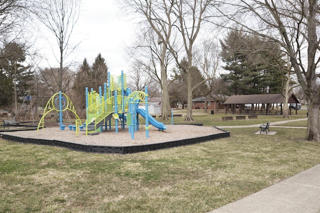 community jungle gym with a yard