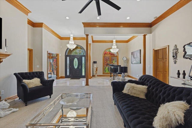 living area with crown molding, ceiling fan, baseboards, carpet floors, and ornate columns