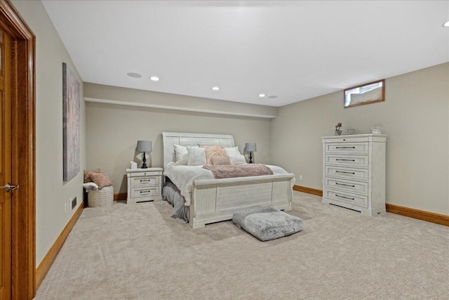 bedroom with baseboards, recessed lighting, and light carpet