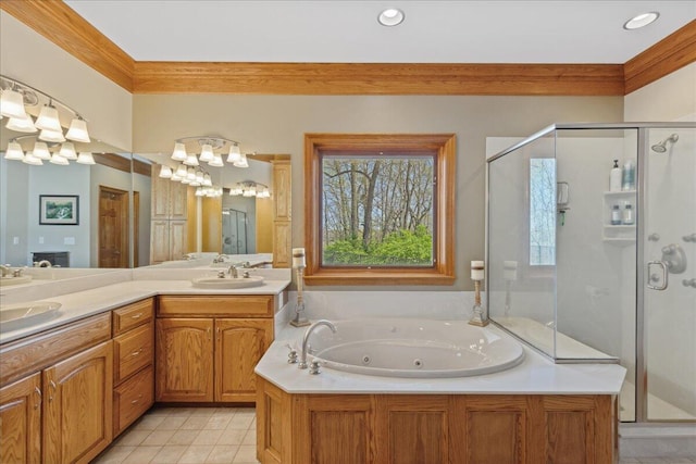 bathroom featuring a jetted tub, a stall shower, tile patterned flooring, and a sink