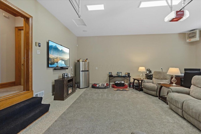 living area featuring baseboards and visible vents