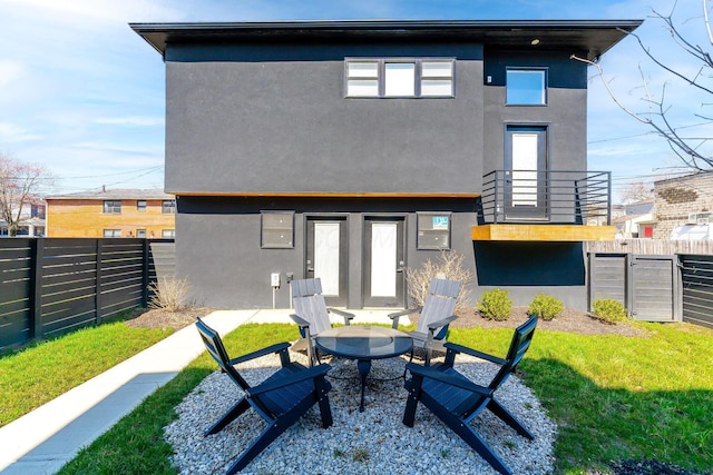 back of property with a patio area, a fenced backyard, and stucco siding