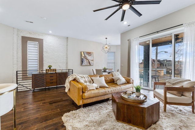 living room with ceiling fan, wood finished floors, visible vents, and recessed lighting