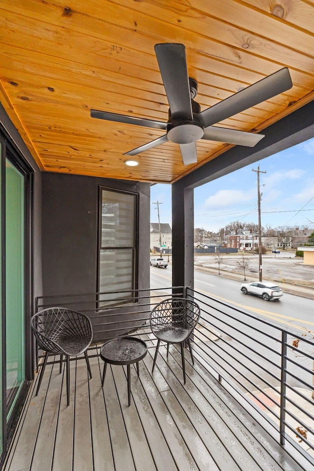 wooden deck featuring a ceiling fan