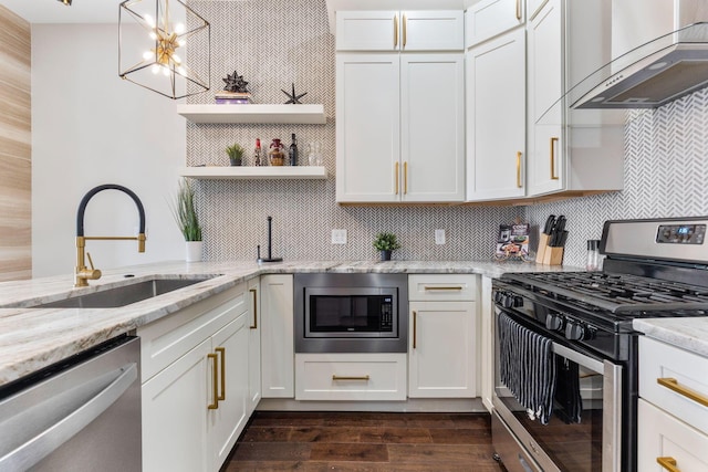 kitchen featuring appliances with stainless steel finishes, a sink, ventilation hood, open shelves, and backsplash