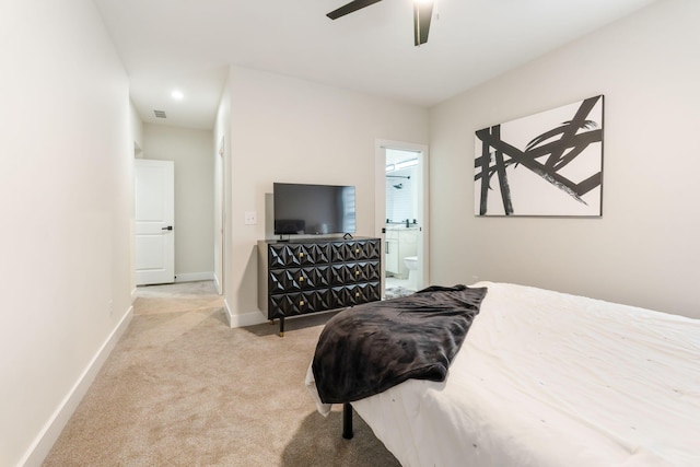 bedroom featuring carpet floors, visible vents, connected bathroom, ceiling fan, and baseboards