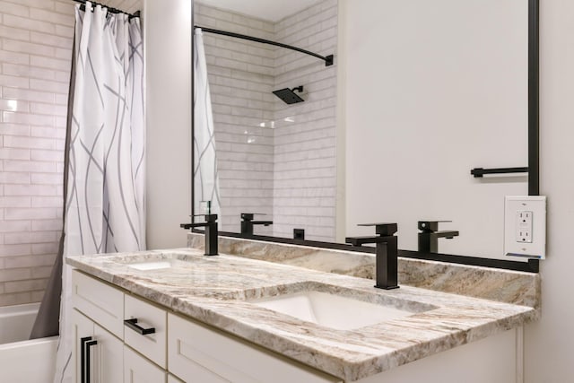 bathroom featuring double vanity, a sink, and shower / tub combo with curtain