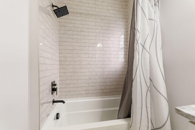 bathroom with shower / tub combo with curtain