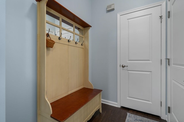 mudroom with baseboards and dark wood finished floors