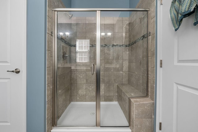 bathroom featuring a stall shower