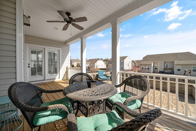 deck featuring a residential view and ceiling fan