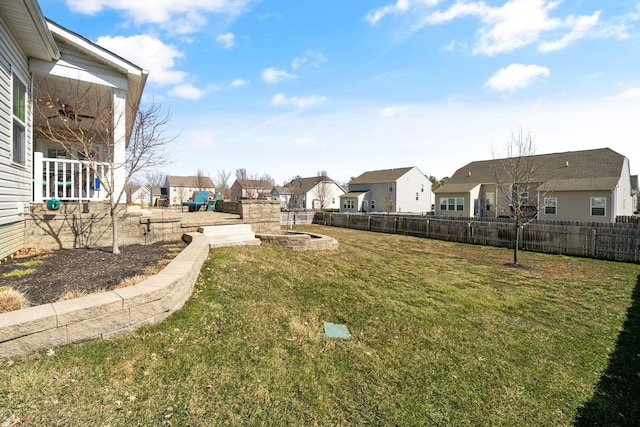 view of yard featuring a residential view and fence