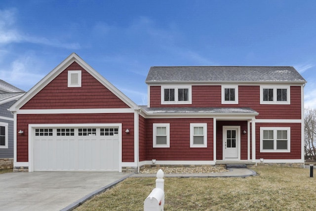 view of front facade featuring driveway and an attached garage