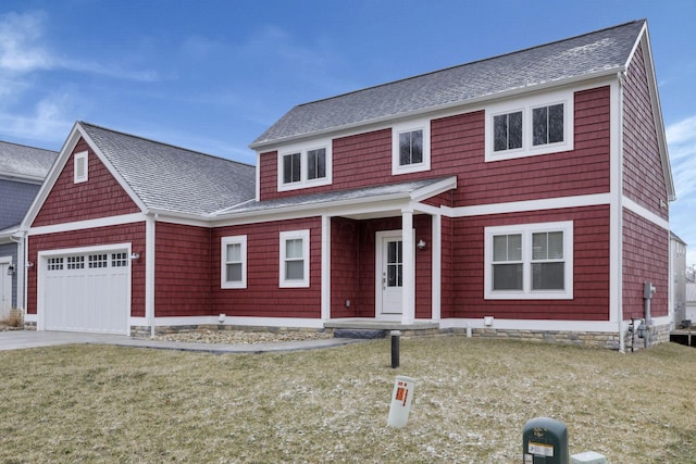 view of front of house with a garage, driveway, a shingled roof, and a front lawn