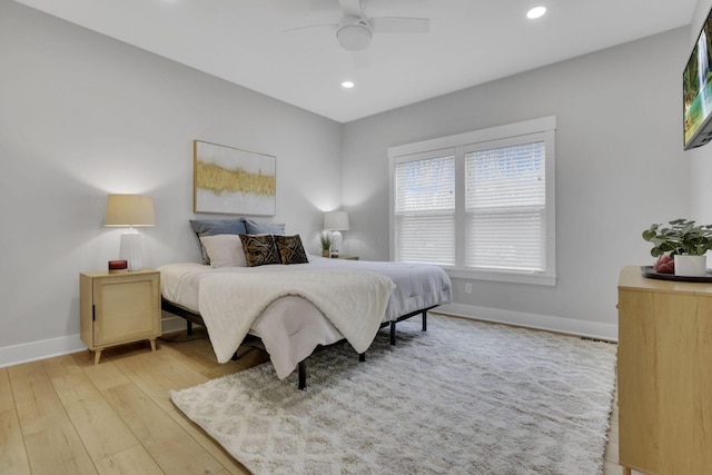 bedroom with light wood-type flooring, ceiling fan, baseboards, and recessed lighting