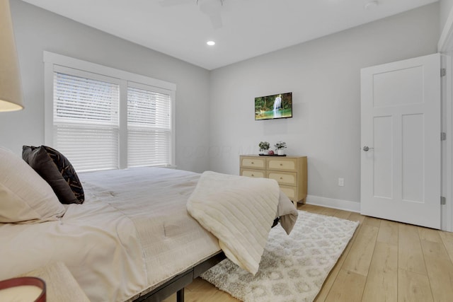 bedroom featuring baseboards, ceiling fan, recessed lighting, and light wood-style floors