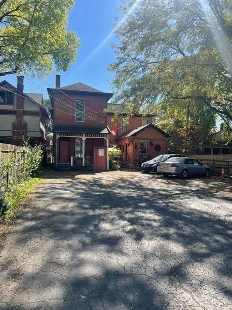 view of front of home with fence and a chimney